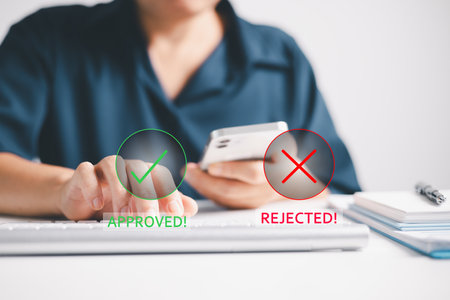 Business reviewed document, weighing choice to approve or reject it, marking a tick for quality approval as part of their concept. business, check, document, approval, choice, quality, tick, reject.の写真素材