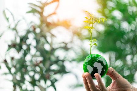 Promoting sustainable energy and green practices is essential for preserving Earth's environmental resources and ensuring a healthy global ecology. earth, eco, environmental, sustainable, green.の写真素材