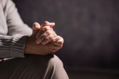 Woman clasped her hands in prayer, filled with faith and hope, believing in Jesus Christ, and seeking the holy presence of God through her prayers in the spirit of Christian religion. pray, woman.の写真素材