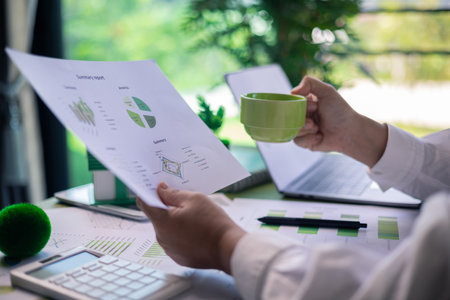 Analyzing green building performance metrics during business meeting. data analysis, green building,...