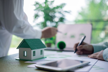 Business meeting on sustainable real estate development. real estate, sustainable development, business meeting, green building, eco-friendly, architecture, planning, construction, investment.の写真素材