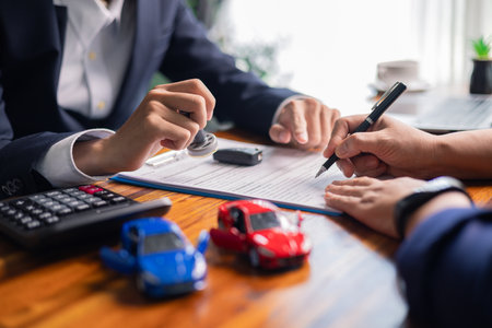 Client reviewed finance documents for business loan, including insurance contract, mortgage agreements, and final deal terms. loan, business, finance, client, document, insurance, contract, mortgage.の写真素材