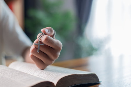 Man is faith in God and belief in Jesus Christ were strengthened through daily prayer and worship, as he found hope and guidance in Bible and his religion. grace, meditation, reading, devotion, group.の写真素材