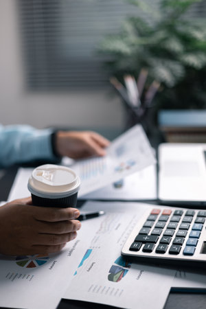 Finance bank tax expense accounting budget money hand use calculator Financial calculate with graph chart write office desk Business expense analysis savingの写真素材