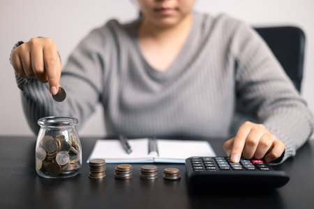 Finance bank tax expense accounting budget money businessman hand use calculator Financial calculate...