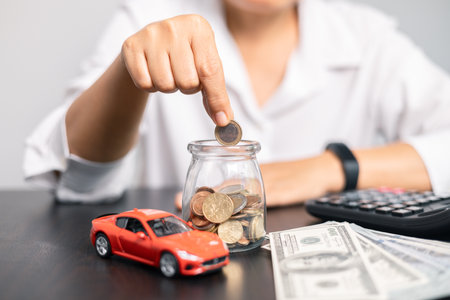 Finance bank tax expense accounting budget money businessman hand for Business expense analysis saving use car Financial calculate accountant close up calculator with graph chart write office deskの写真素材