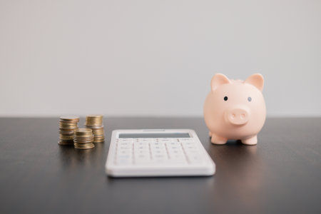 Finance tax expense accounting budget money businessman hand use calculator Financial calculate accountant close up calculator with graph chart write office desk Business expense analysis savingの写真素材