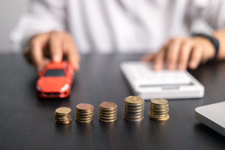 Finance bank tax expense accounting budget money businessman hand for Business expense analysis saving use car Financial calculate accountant close up calculator with graph chart write office deskの写真素材