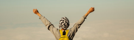 Man traveler with backpack hiking outdoor travel lifestyle and adventure concept. join of tourist for green mountain tour beauty of nature and expansive sky people of tourism. banner with copy spaceの写真素材