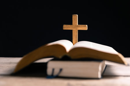 Religious belief concept Close up prayer Christian church service Bible Holy cross Spiritual power Blurred background Desk copy space Heaven God Catholic faith Praise book Jesus worship Gospel symbolsの写真素材