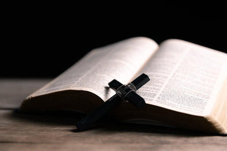 Religious belief concept Close up prayer Christian church service Bible Holy cross Spiritual power Blurred background Desk copy space Heaven God Catholic faith Praise book Jesus worship Gospel symbolsの写真素材