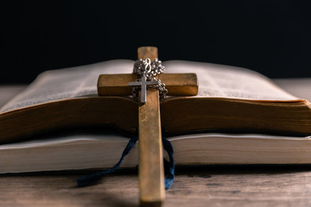 Religious belief concept Close up prayer Christian church service Bible Holy cross Spiritual power Blurred background Desk copy space Heaven God Catholic faith Praise book Jesus worship Gospel symbolsの写真素材