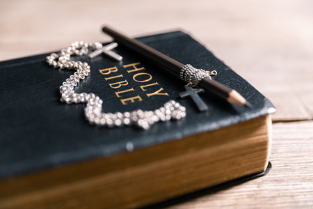 Religious belief concept Close up prayer Christian church service Bible Holy cross Spiritual power Blurred background Desk copy space Heaven God Catholic faith Praise book Jesus worship Gospel symbolsの写真素材