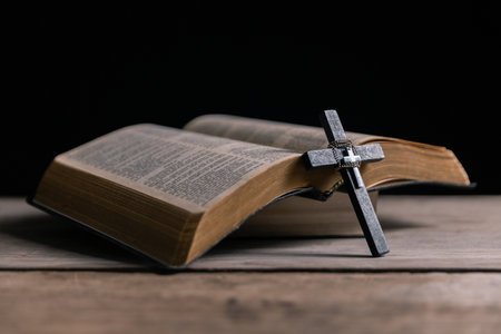 Religious belief concept Close up prayer Christian church service Bible Holy cross Spiritual power Blurred background Desk copy space Heaven God Catholic faith Praise book Jesus worship Gospel symbolsの写真素材