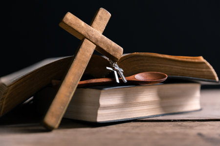 Religious belief concept Close up prayer Christian church service Bible Holy cross Spiritual power Blurred background Desk copy space Heaven God Catholic faith Praise book Jesus worship Gospel symbolsの写真素材