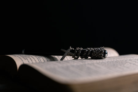 Religious belief concept Close up prayer Christian church service Bible Holy cross Spiritual power Blurred background Desk copy space Heaven God Catholic faith Praise book Jesus worship Gospel symbolsの写真素材