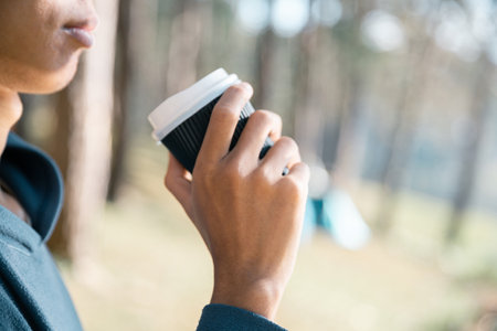 Business concept of cafe focuses on nurturing coffee in harmony with nature, organic seed create warm cup caffeine, background green fresh great outdoor. aromatic drink, rich aroma of rising from mugの写真素材