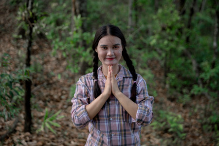 Grateful woman having HOPE. Spiritual girl smiling to sky. Happy female being thankful. Spiritual girl praying with hope. Positive Asian young woman feeling hope and faith looking up.の写真素材