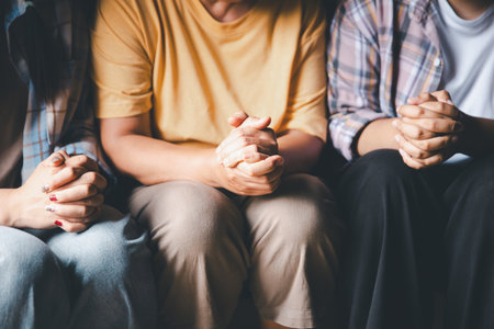 Close up group christians hands pray to God with spiritual faith on holy bible in catholic church. religion worship prayer ask god bless grace jesus believe. Christianity religion prayer holy worshipの写真素材