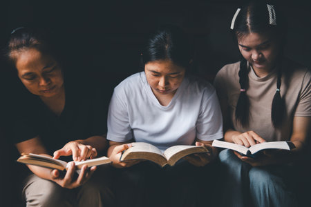 Praying religion, worship and group of people pray to God, Family, holding hands and prayer in home for love, support and faith or hope in house. holy spirit or Jesus for peace or spiritual praise.の写真素材