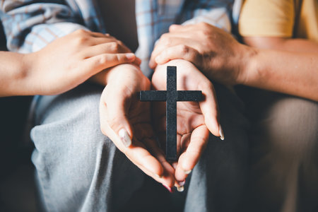 Close up group christians hands pray to God with spiritual faith on holy bible in catholic church. religion worship prayer ask god bless grace jesus believe. Christianity religion prayer holy worshipの写真素材