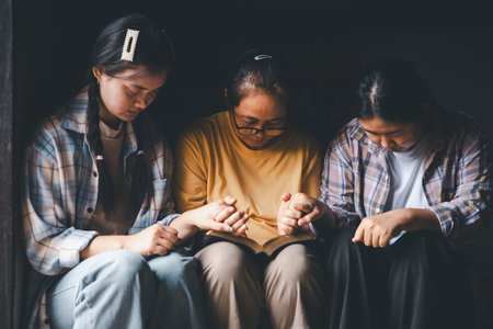 Close up group christians hands pray to God with spiritual faith on holy bible in catholic church. religion worship prayer ask god bless grace jesus believe. Christianity religion prayer holy worshipの写真素材