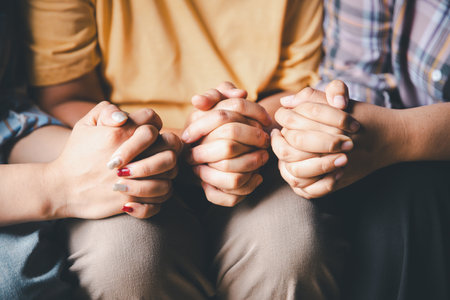 Close up group christians hands pray to God with spiritual faith on holy bible in catholic church. religion worship prayer ask god bless grace jesus believe. Christianity religion prayer holy worshipの写真素材