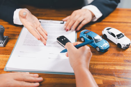 à¸ºBusinessman approval stamper stamp on paper business contract. car loan money approved. Dealer...