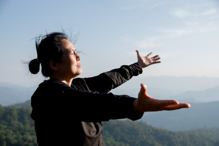 Grateful woman having HOPE. Spiritual girl smiling to sky. Happy female being thankful. Spiritual girl praying with hope. Positive Asian young woman feeling hope and faith looking up.の写真素材