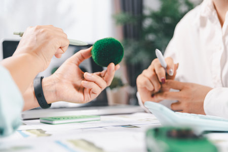 Business people working on sustainable innovation project. renewable energy concept. Teamwork Meeting, partner on model building company office technology, based green businesses and global warming.の写真素材