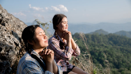 Grateful woman having HOPE praying to God. Spiritual girl smiling to sky. Happy female being thankful. Spiritual girl praying with hope. Positive Asian young woman feeling hope and faith looking up.の写真素材