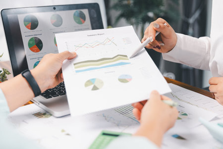 Business people working on sustainable innovation project. renewable energy concept. Teamwork Meeting, partner on model building company office technology, based green businesses and global warming.の写真素材