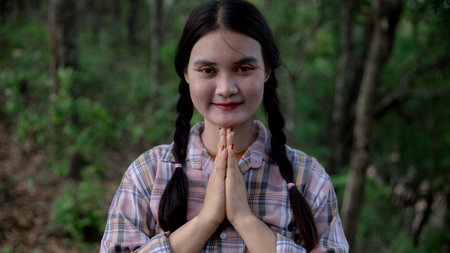 Grateful woman having HOPE praying to God. Spiritual girl smiling to sky. Happy female being...