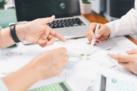 Business people working on sustainable innovation project. renewable energy concept. Teamwork Meeting, partner on model building company office technology, based green businesses and global warming.の写真素材