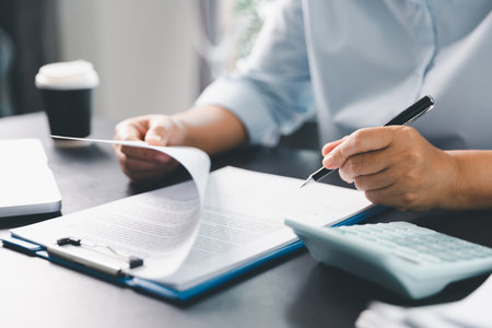 Business person with contract law and paper work for business finance, loan application form, contract real estate and insurance concept. signing contract, working on desk, business documentの写真素材