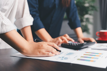 Business meeting, data analytics or women with graph presentation in office. Chart, analysis accounting team brainstorming economy, inflation or solution. business project finance investment concept.の写真素材