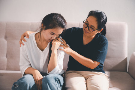 Moment of deep grief, sorrow and anxiety, lonely person overwhelmed by despair feels spark of hope when helping hand reaches out with genuine emotion to ease their problem.の写真素材