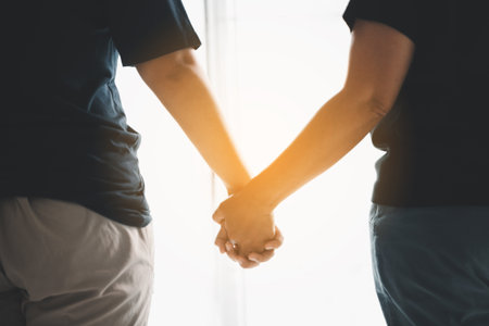 Hope and trust with crisis concept. Closeup, love and holding hands for support, comfort and care with grief, loss and empathy. people and family with compassion, sympathy and healing with bonding.の写真素材