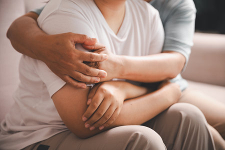 Hope and trust with crisis concept. Closeup, love and holding hands for support, comfort and care with grief, loss and empathy. people and family with compassion, sympathy and healing with bonding.の写真素材