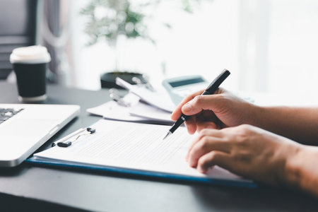 Business person with contract law and paper work for business finance, loan application form, contract real estate and insurance concept. signing contract, working on desk, business documentの写真素材