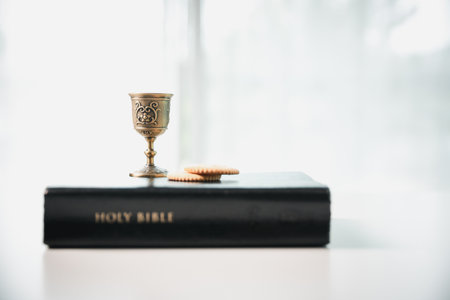Christianity, holy communion ceremony is sacred act of worship and faith, where bread and wine in chalice symbolize body and blood of Christ in the religious eucharist tradition.の写真素材