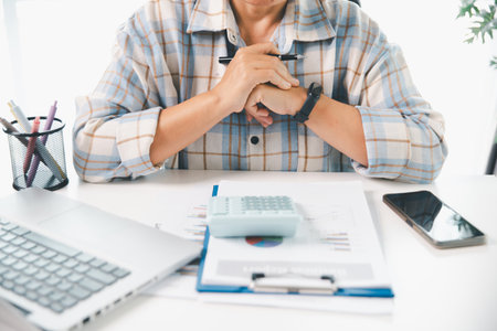 Businesswoman analysis with financial data, marketing business strategy project, Business financing accounting banking concept, finances, calculate about cost to real estate investment, tax system.の写真素材