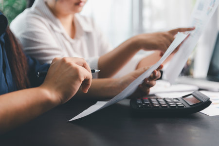 Business meeting, data analytics or women with graph presentation in office. Chart, analysis accounting team brainstorming economy, inflation or solution. business project finance investment concept.の写真素材