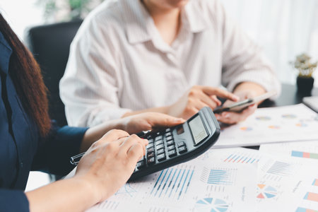 Business meeting, data analytics or women with graph presentation in office. Chart, analysis accounting team brainstorming economy, inflation or solution. business project finance investment concept.の写真素材