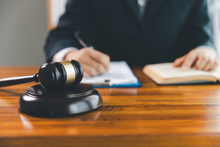 Justice and lawfirm concept. Female lawyer in office with brass scale. Woman hand gavel to bang. Law...