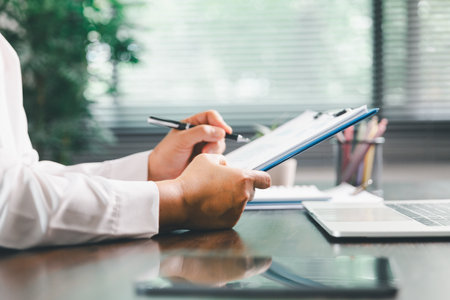 Businesswoman manages finances by using banking and accounting system to calculate costs, taxes,...