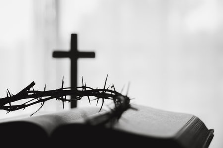 Crown of thorns and cross powerful symbols in Christianity, representing holy sacrifice of Jesus Christ in Bible and serving as enduring reminders of faith and core of Christian religion.の写真素材