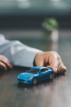 Car loan approval concept. Client finalizes purchase of vehicle by signing contract includes auto...