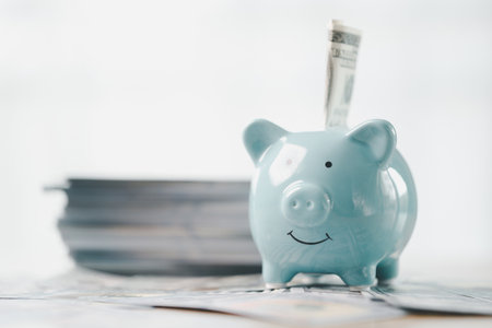 Money box filled with coins, saving cash, banking wisely, making sound investments can build financial wealth, personal finance and overall economy through proper business and currency management.の写真素材