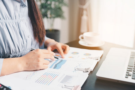 Business woman analyze calculate company financial, tax results office accounting statistics analytical research. calculating business balance prepare tax reduction. Tax deduction planning concept.の写真素材